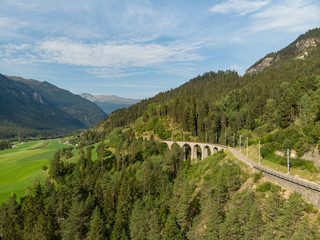 Fototapeta na wymiar Aerial view on railway in the Alps, near Locarno, Switzerland. August, 2018