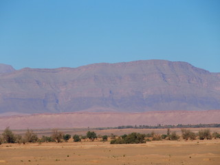 Fototapeta na wymiar Calm view of sandy desert at high ATLAS MOUNTAINS range landscape in MOROCCO