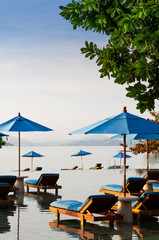 Fototapeta na wymiar Vacation Relaxation resort beach bed in infinity pool tropical sea view, Phuket Thailand