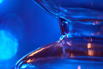 Glass bulb./Glass bulb on a blue background. Abstract photo of the glass.