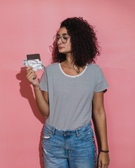 Curly haired woman holding chocolate