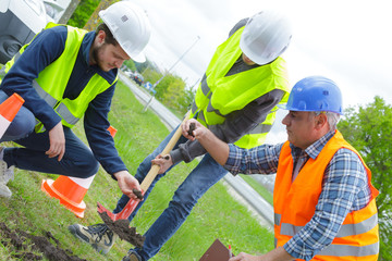 teaching an apprentice how to dig