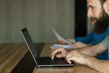 smm or social media marketing. seo specialist working on laptop in office. internet technologies...