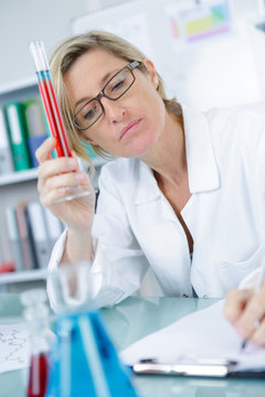 female technician with pipetting pcr strope