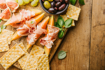 Mediterranian appetizers on old wooden table