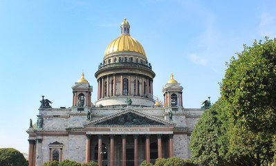 Fototapeta premium St. Isaac's Cathedral in Saint Petersburg, Russia. Church and Museum Building, Famous Old Cultural City Architecture Landmark. Saint Isaac Cathedral Front View on Blue Sky Sunny Summer Day Background