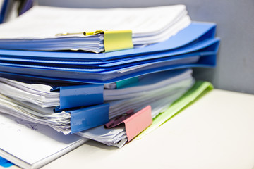file folder and Stack of business report paper file on the table in a work office, concept document in work office