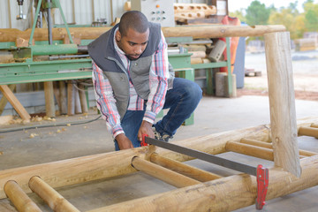 Man clamping wood together