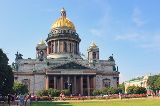 St. Isaac's Cathedral in Saint Petersburg, Russia on Summer Day. Panoramic Colorful Image of Touristic Landmark in St. Petersburg City. Scenic View of St. Isaac Church on Empty Blue Sky Background