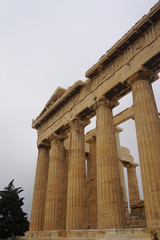 Fototapeta premium Athens, Greece: Detail of the Parthenon, 447-438 BCE, at the Acropolis of Athens, under a hazy sky caused by dust pollution.