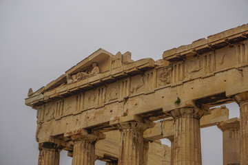 Athens, Greece: Detail of the Parthenon, 447-438 BCE, at the Acropolis of Athens, under a hazy sky caused by dust pollution.