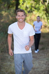 Fototapeta premium couple running in forest