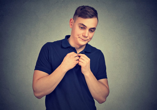 Shy young man looking awkward