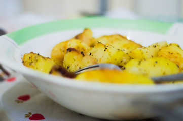 bowl of pumpkin soup with potatoes