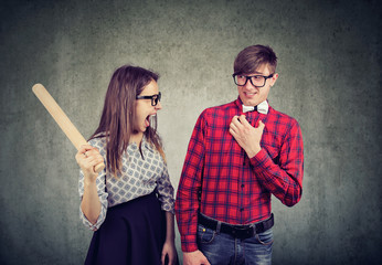 Arguing young couple screaming in quarrel