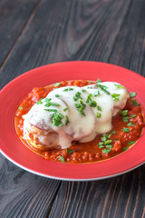 Chicken with pepperoni and tomato sauce