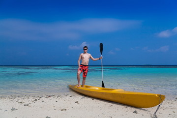 Maldives,  man in canoe