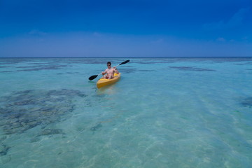 Maldives,  man in canoe