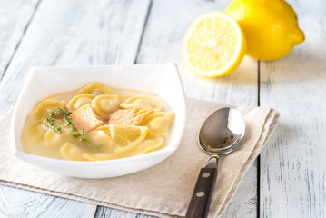 Portion of seafood ravioli soup
