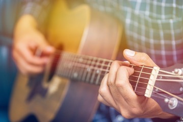 Close up of guitar player