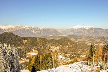 Fototapeta na wymiar Panoramic view of beautiful winter wonderland mountain scenery in the austrian Alps. Mountains ski resort Semmering - nature and sport background.
