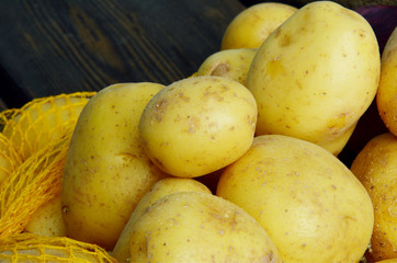 Fresh Many Potatoes and Potato Net Bag Packing with full frame.