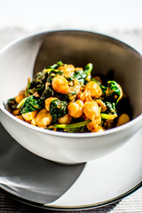 A bowl of chickpeas with spinach, mediterranean cuisine
