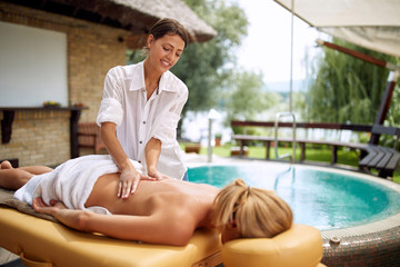 Beauty Spa Treatment-Woman having massage in the spa salon.