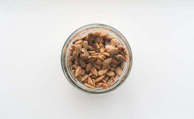 flatlay sunflower seeds in a glass jar