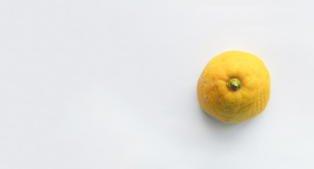 half lemon face down on white background