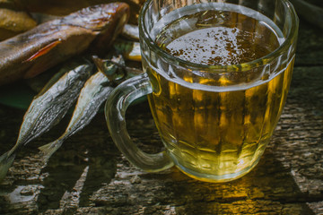 glass of beer with dried fish