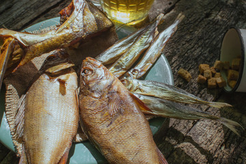 fish snacks to beer on wooden background