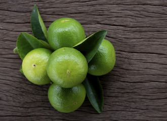 Freshness  green lemon on wooden background