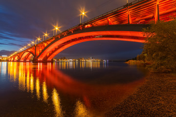 Fototapeta na wymiar Reflection of the Communal Bridge in the Yenisei river, Krasnoyarsk, Russia. Urban landscape