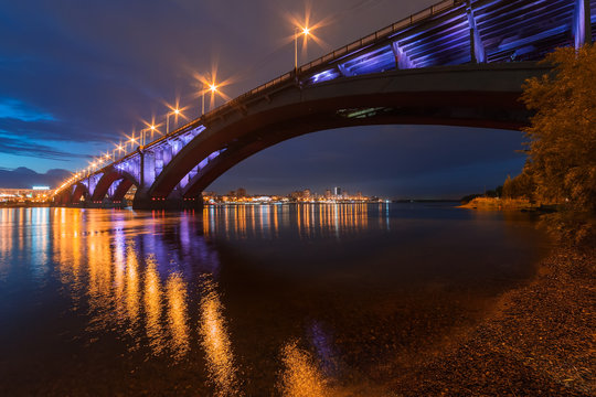 Reflection of the Communal Bridge in the Yenisei river, Krasnoyarsk, Russia. Urban landscape