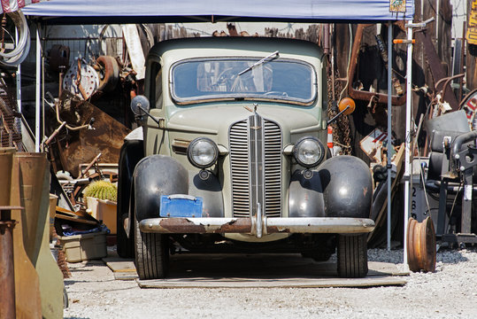 Front view of an antique vintage classic car in a repair shop in Venice, California