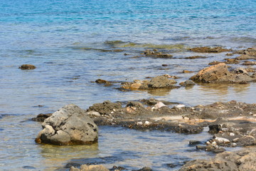 Fototapeta na wymiar Afytos beach in Greece, rocks and blue sea