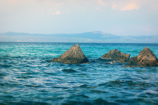 Afytos beach in Greece, rocks and blue sea
