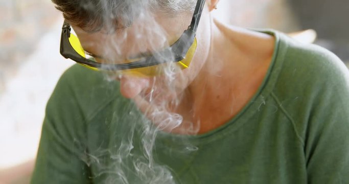 Female electrical engineer working at desk in office 4k