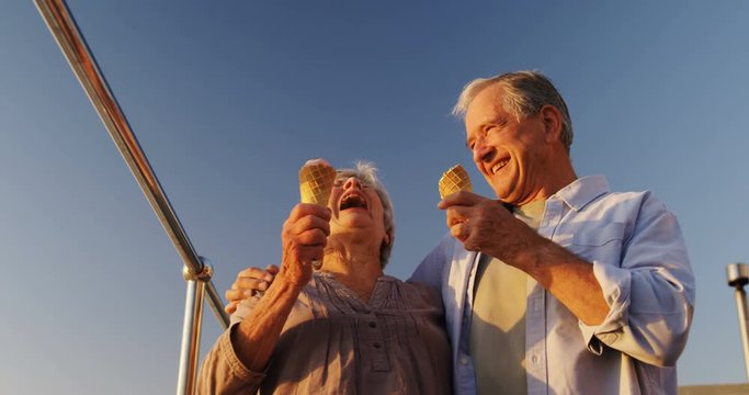 Senior couple having ice cream at promenade 4k