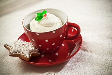 Cupcake in the tea cup with gingerbread cookie