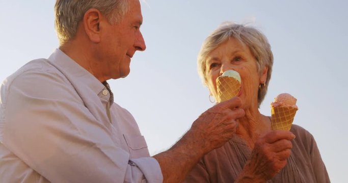 Senior couple having ice cream at promenade 4k