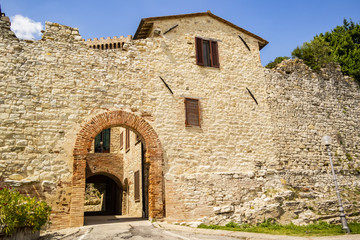 Fototapeta na wymiar Entrance walls in the medieval village of Castiglione del Lago, Umbria - Italy