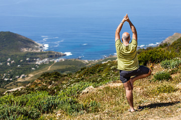 Yoga pose near Mattei mill, Corsica
