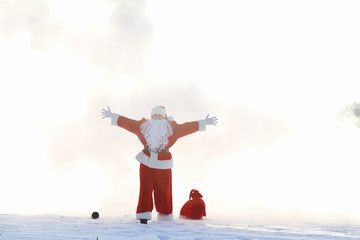 Santa in the winter field. Santa magical fog is walking along th