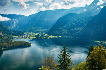 Fototapeta na wymiar Top view of the landscape around Lake Hallstatt with mountains, forest and blue sky