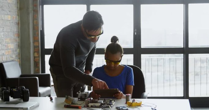 Father and daughter using digital tablet at desk 4k