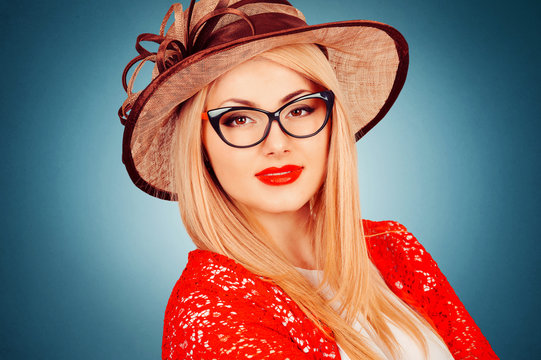 Beautiful young woman with glasses and hat, retro style