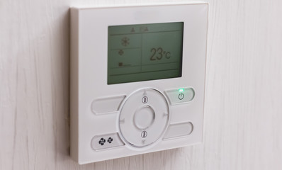 air conditioning thermostat set to 23 degrees