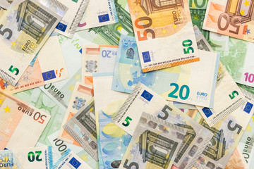 Background from euro banknotes of different denominations. The concept of wealth and luxury